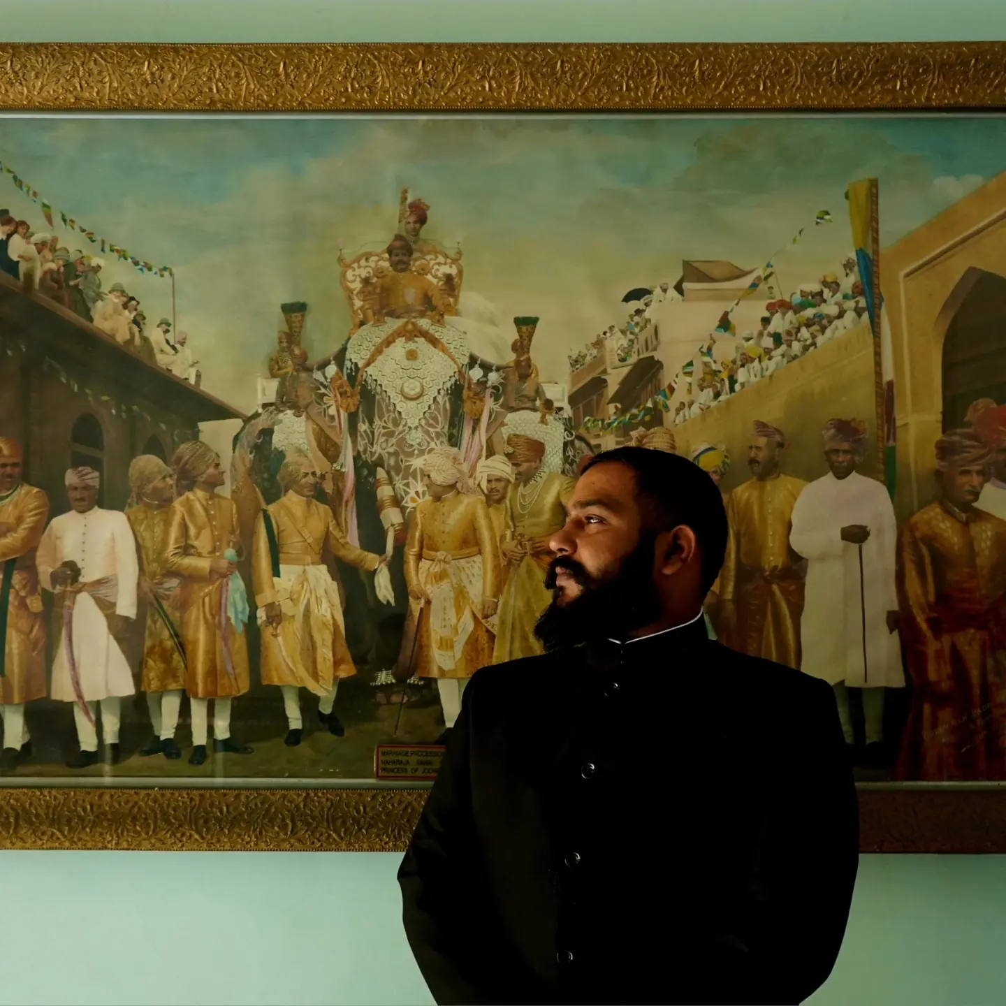 Satyam Tandon before a royal procession painting